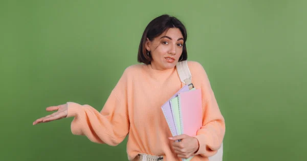 Student shrugging because she made mistakes on the ACT English Test